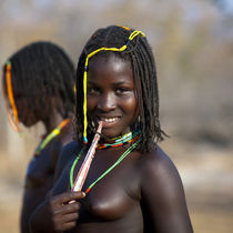 Two leashed naked teen